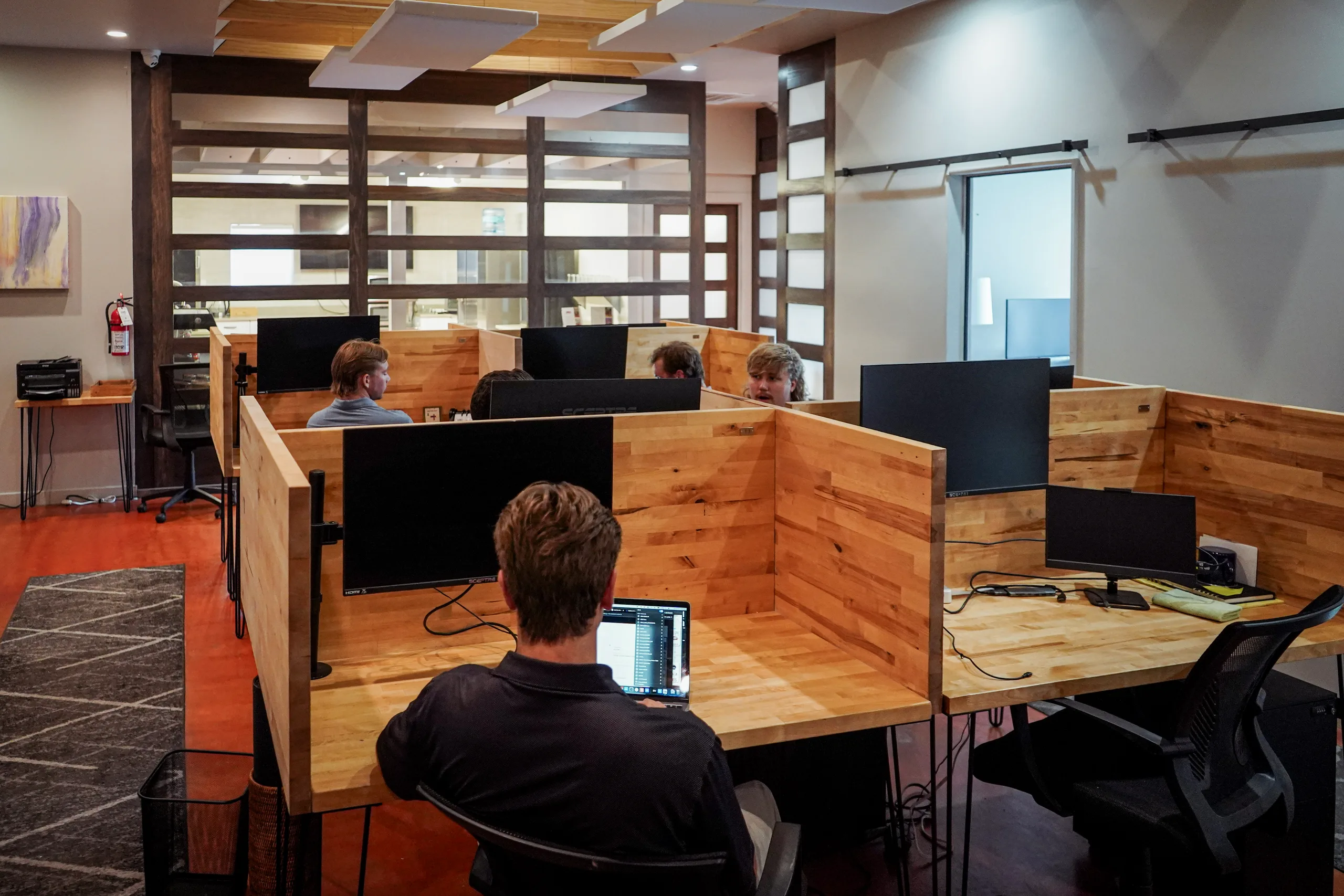 An alternate view across the dedicated desk pods at Merritt Workspace in Sloan's Lake, Denver
