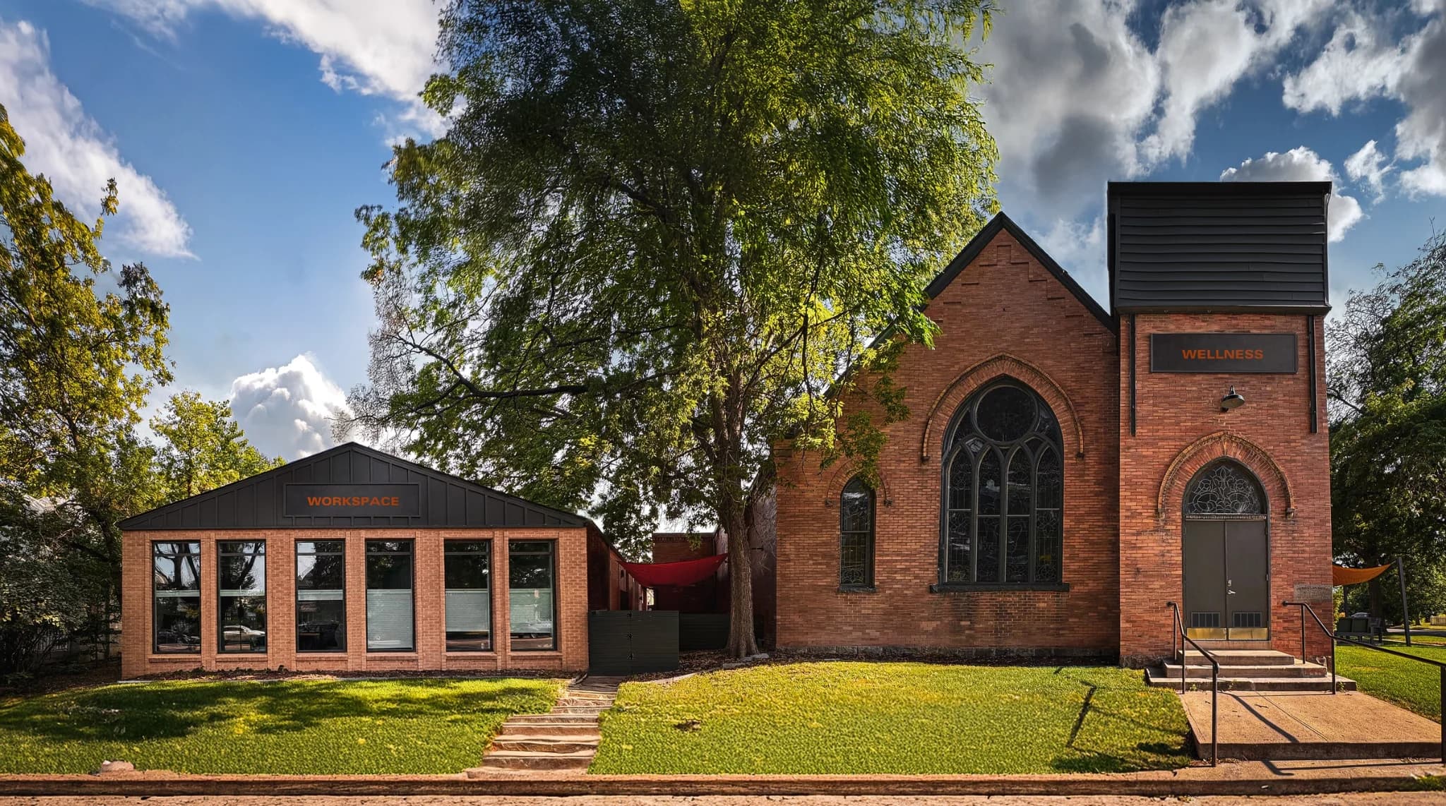 The Merritt Workspace building and the 1905 event space side by side on one lawn in Sloan's Lake, Denver