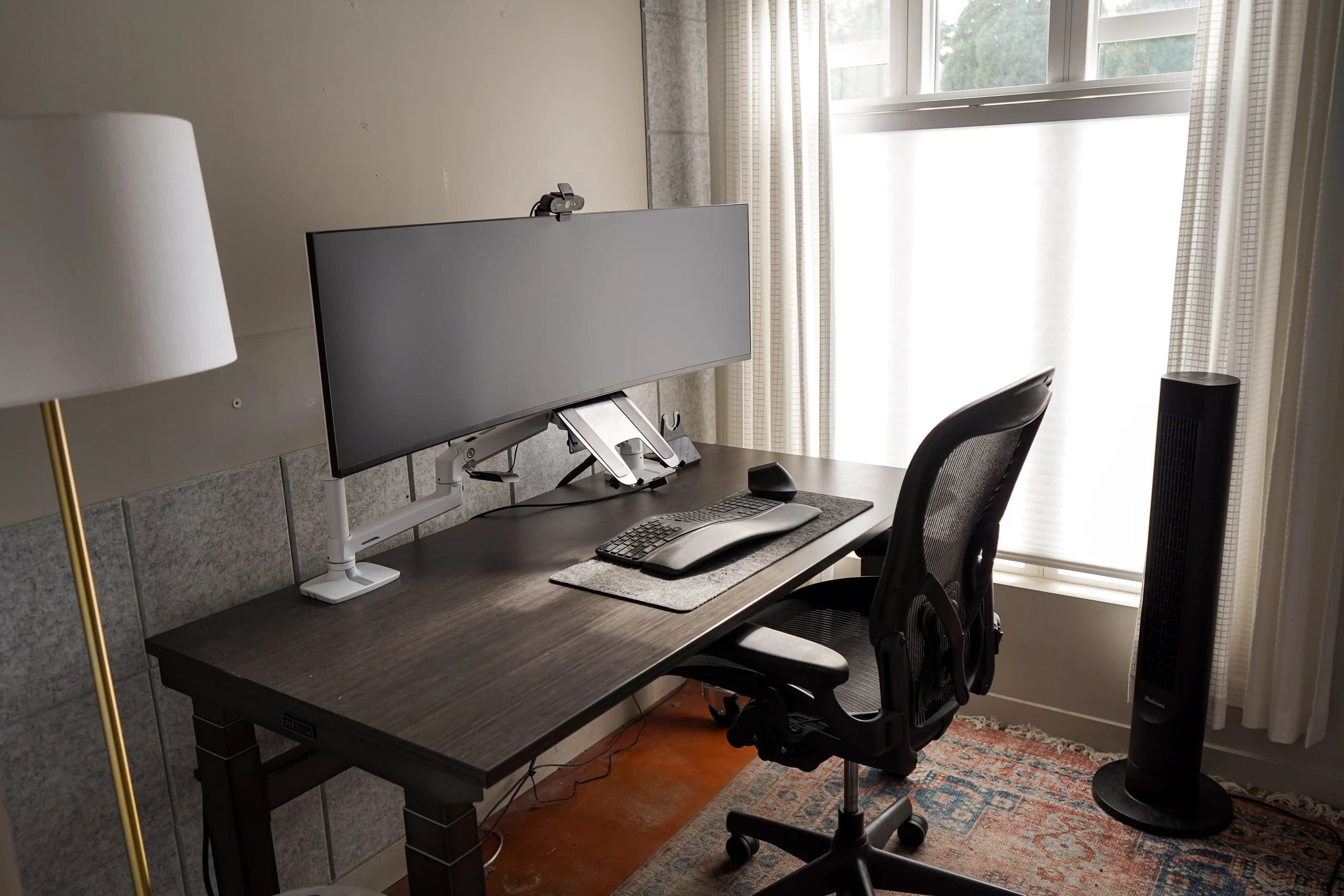 Single private office with an ultrawide monitor and window light at Merritt Workspace, Denver